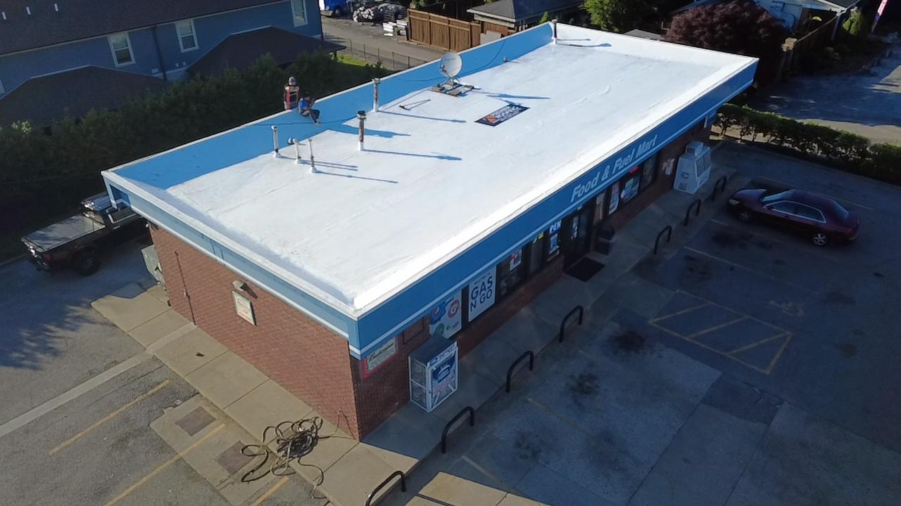 Aerial view of a finished flat roof on the Food and Fuel Mart convenience store